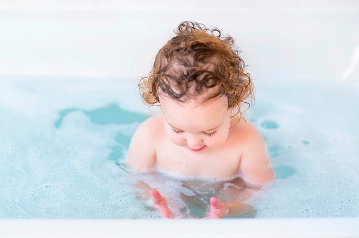 baby in a soapy bath