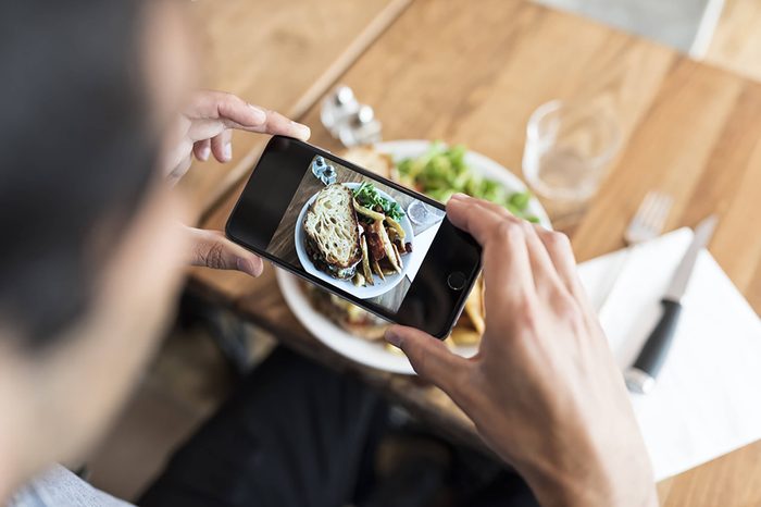 a person taking a picture of their meal with a smartphone