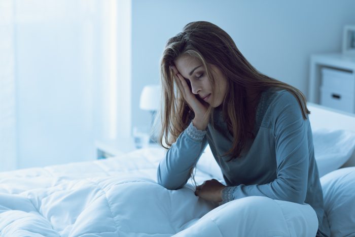 sleeplessness woman bed tired sad