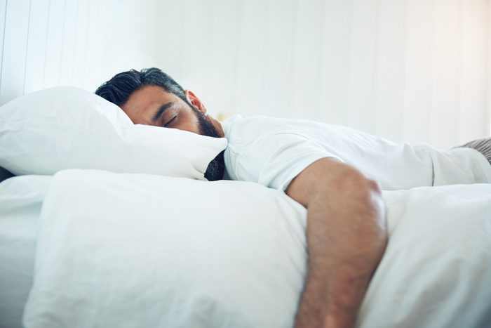 mature man lying on his bed and sleeping